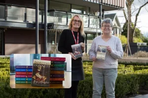 Picture of two people with Dorothy dunnetts books